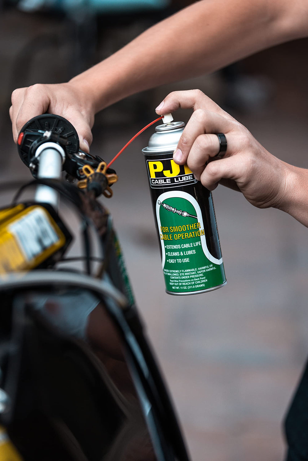 PJ1 Cable Lube cap close-up shows effortless, even coverage
