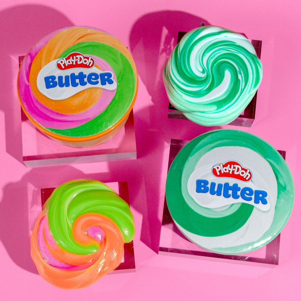 Play-Doh Scented Butter Slime party-favor display offers portable fun for gatherings.