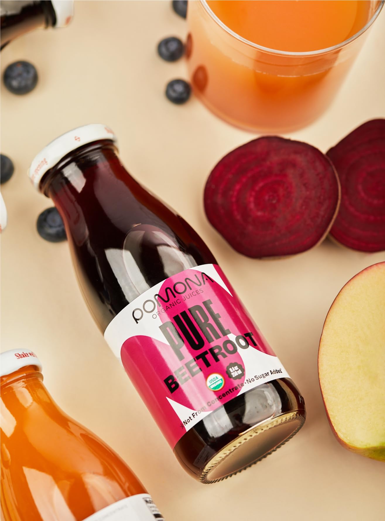 Pomona Organic Beet Juice on shelf in 12-pack, ready to stock your fridge.