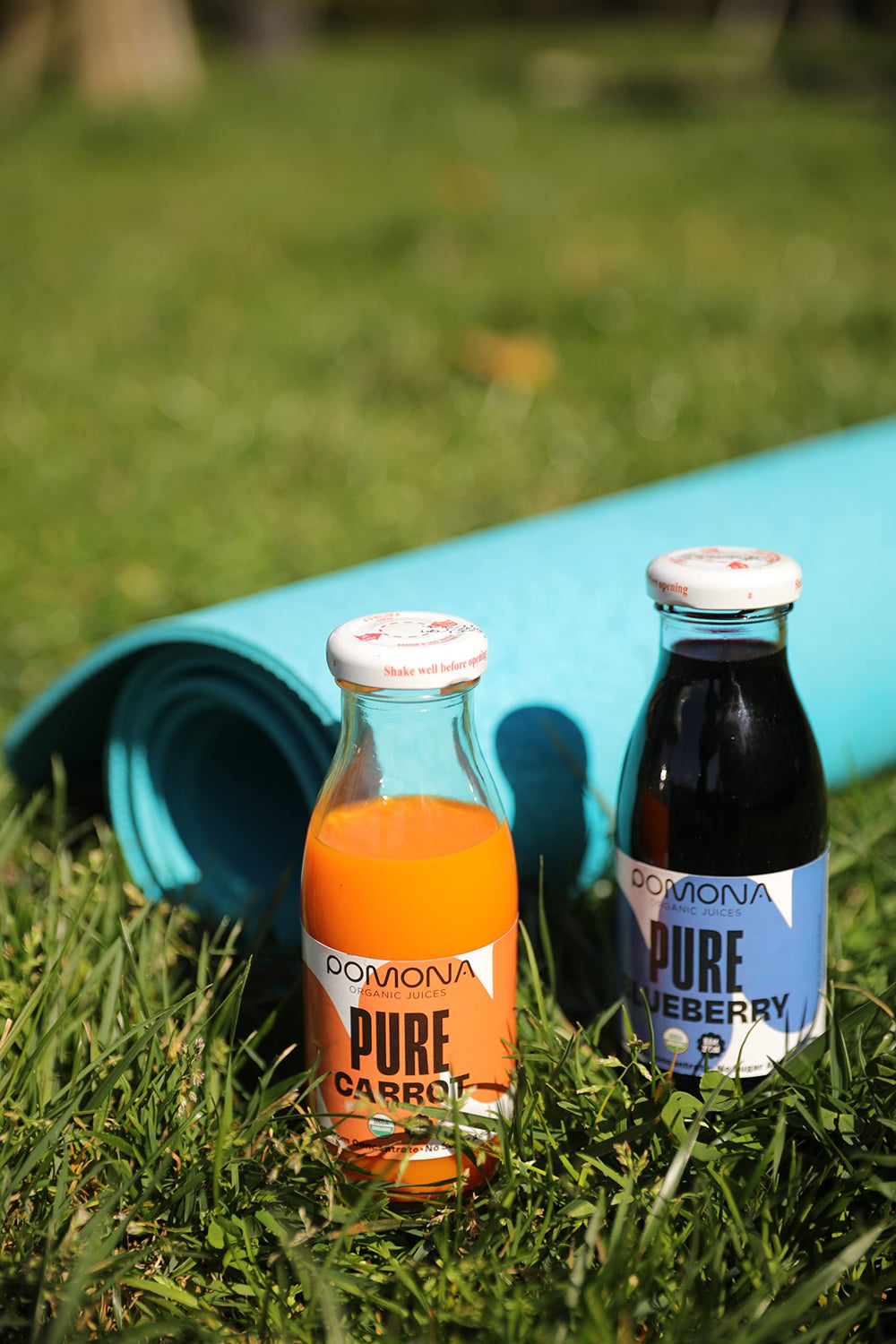 Pomona Organic Juices glass bottles highlight eco-friendly packaging and care.
