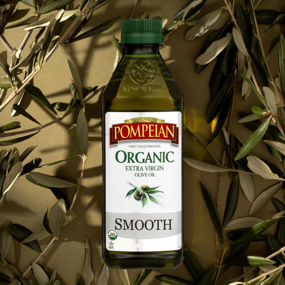 A Pompeian Organic Smooth EVOO kitchen scene with herbs.