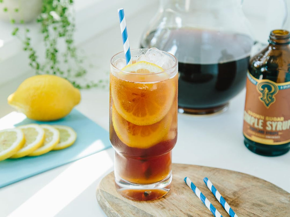 Portland Syrups Brown Sugar Simple Syrup poured into a shaker, ideal for home mixology.