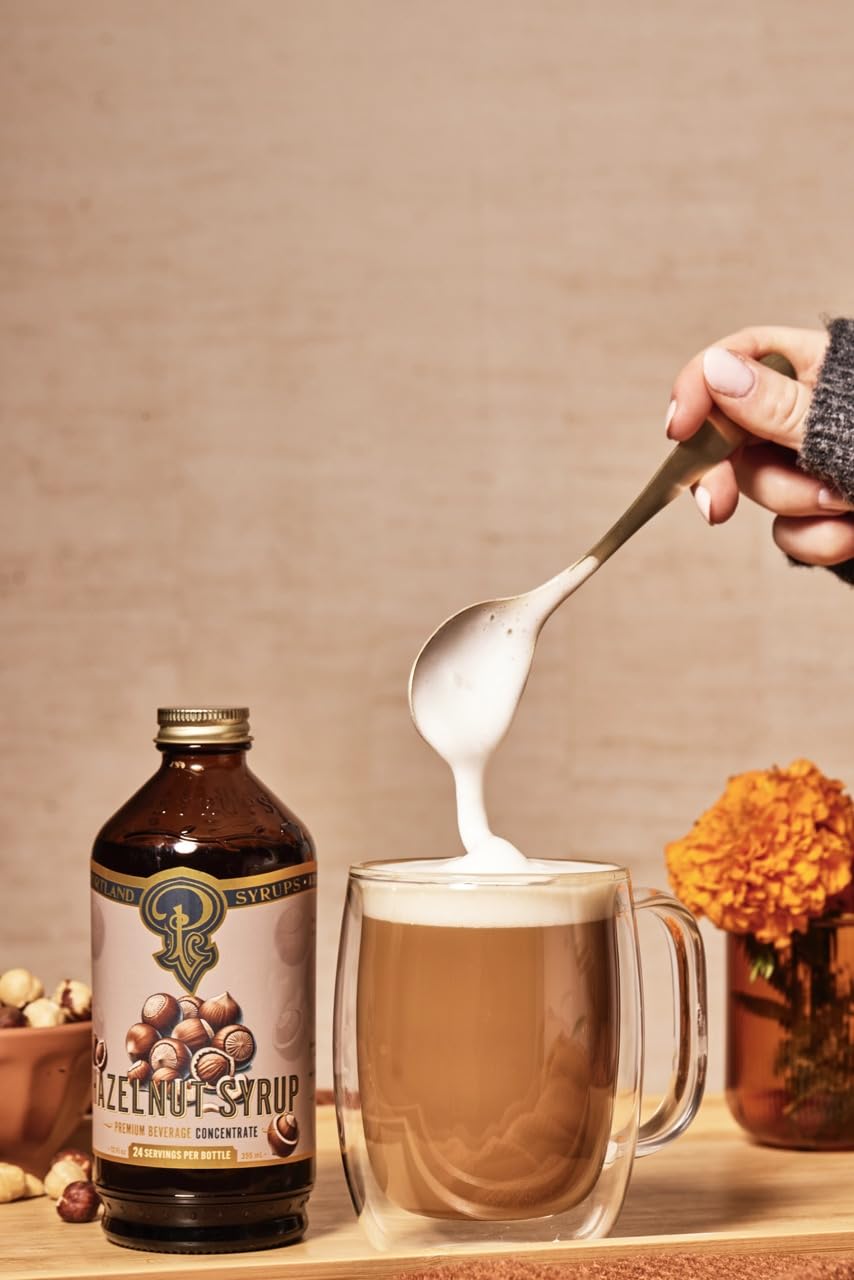 Latte with hazelnut swirls created by Portland Syrups Hazelnut Syrup