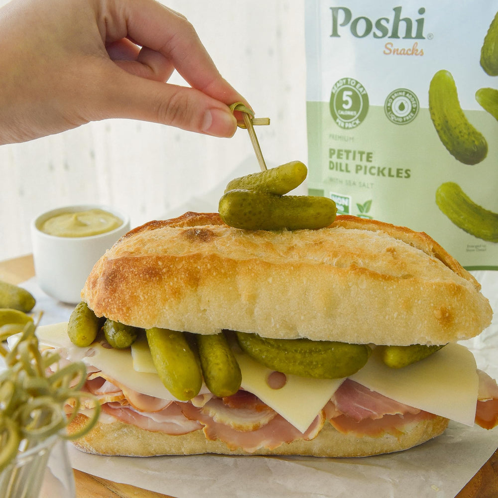 Poshi sea salt dill pickles in bright packaging signaling freshness.