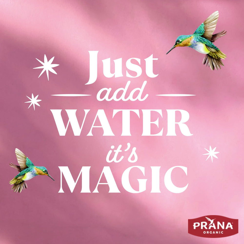 Prana Berry Fairy berry powder close-up with spoon for quick flavor boost.