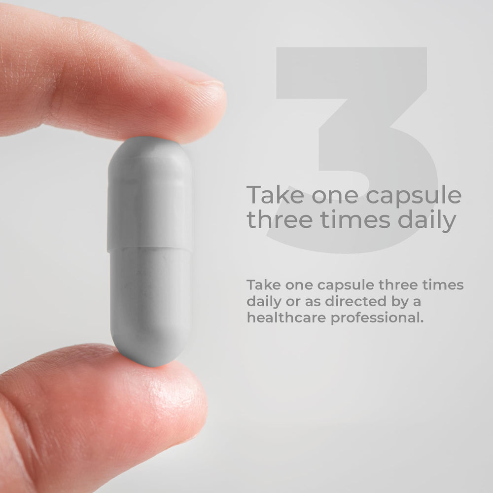 Dosing scene with water beside Medi-Clay-FX capsules