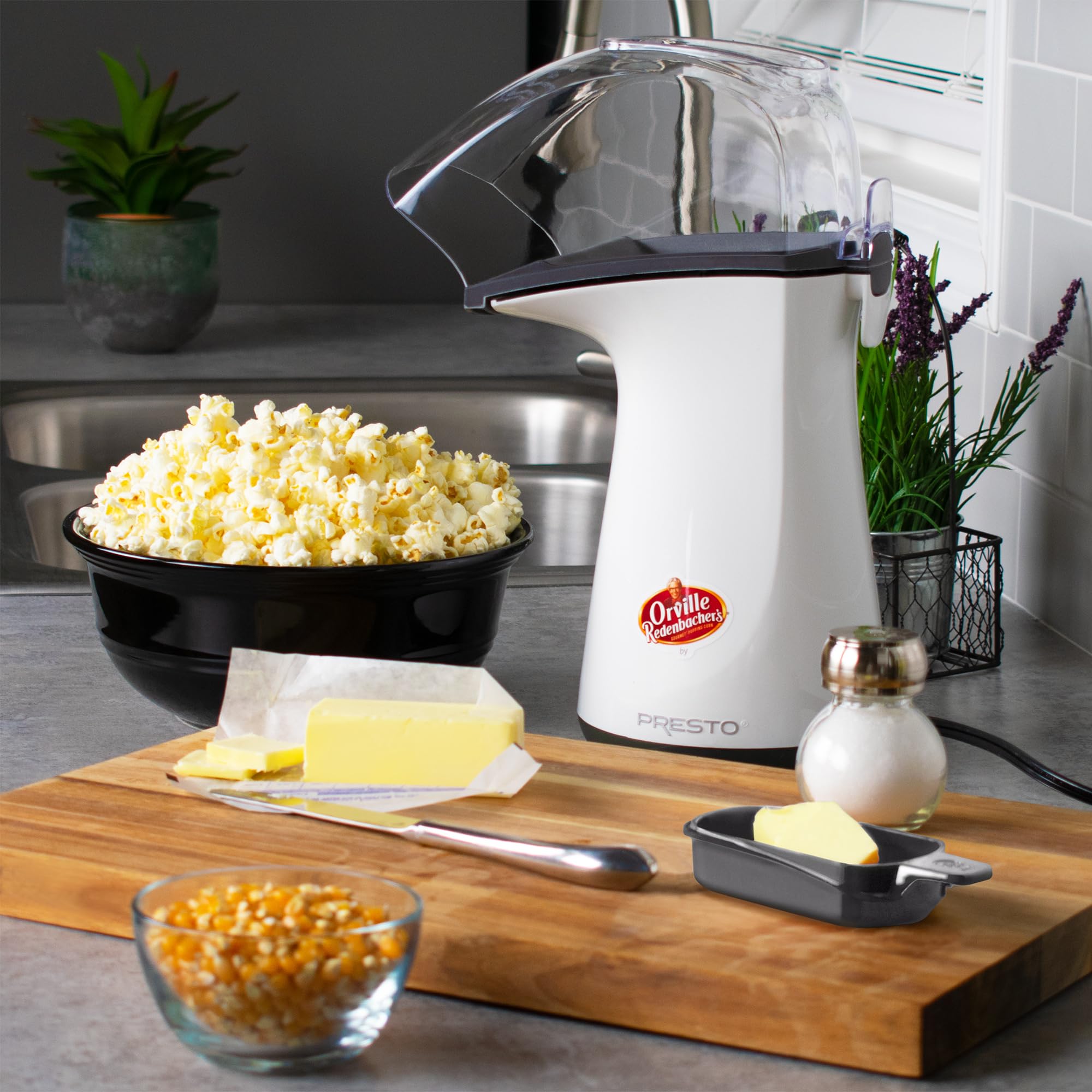 Presto Orville popper chute directs popped corn into a bowl.