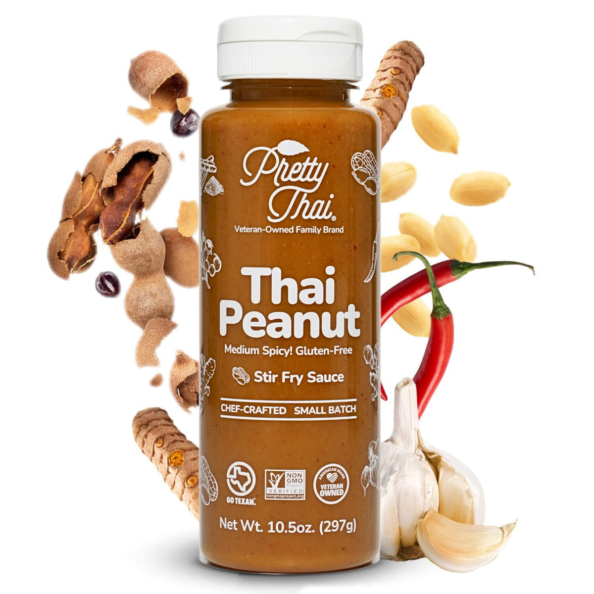 Pretty Thai Peanut Sauce bottle pouring over a sizzling stir-fry for bold flavor