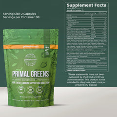 Scoop of Primal Harvest Super Greens powder ready to mix into beverages.