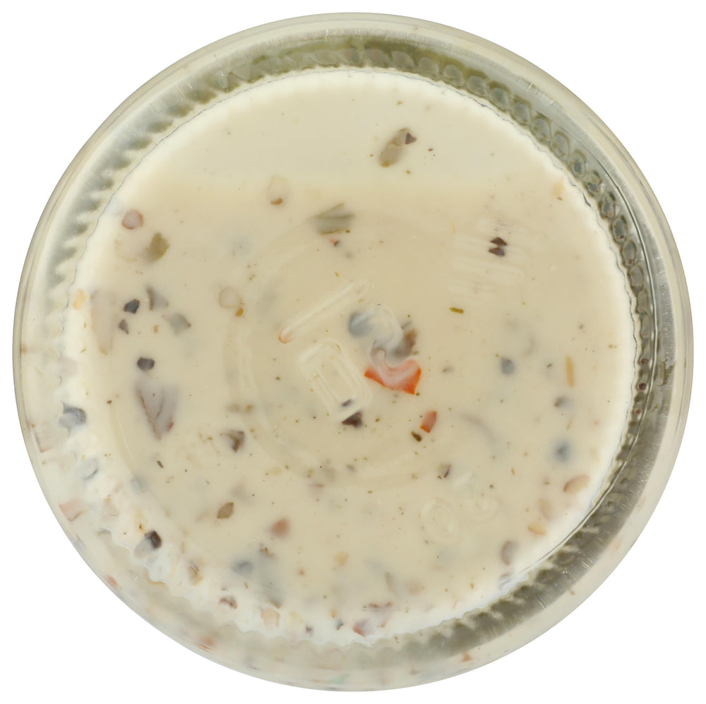Primal Kitchen Dreamy Italian dressing on dining table signals easy family meals.