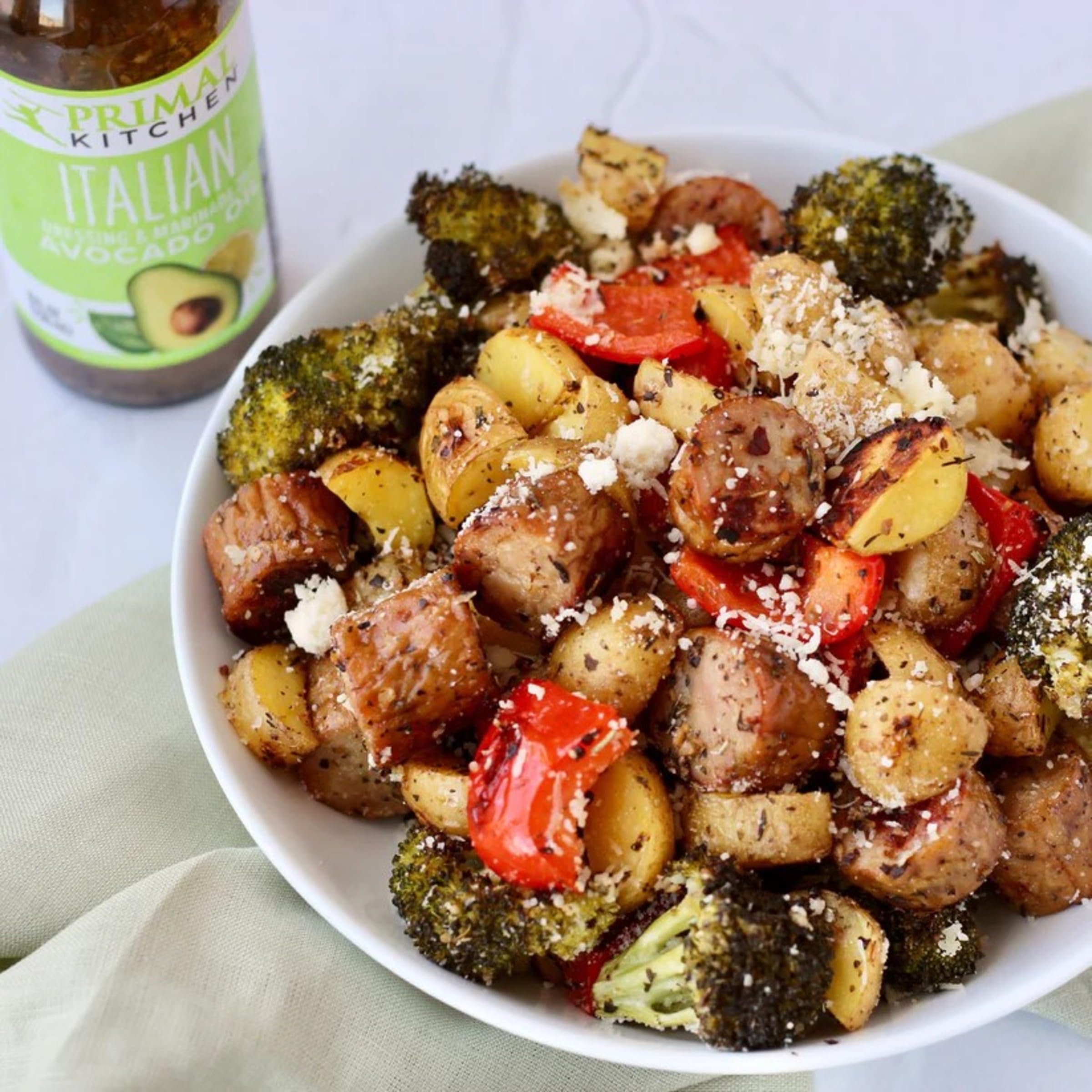 Primal Kitchen Italian Vinaigrette antipasti plate with vibrant flavors.