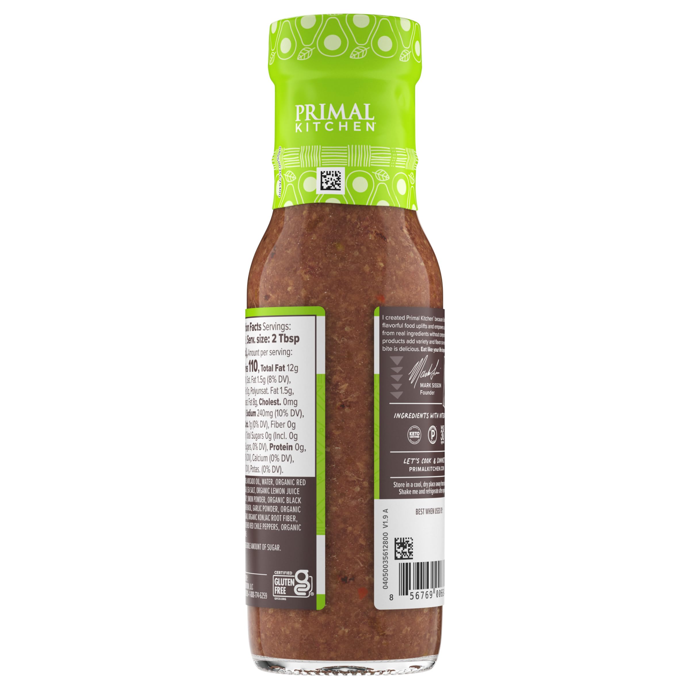 Primal Kitchen Italian Vinaigrette glass bottle on a kitchen shelf.