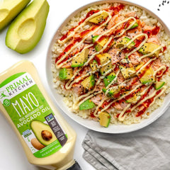 Primal Kitchen mayo being squeezed for easy dipping and spreading.