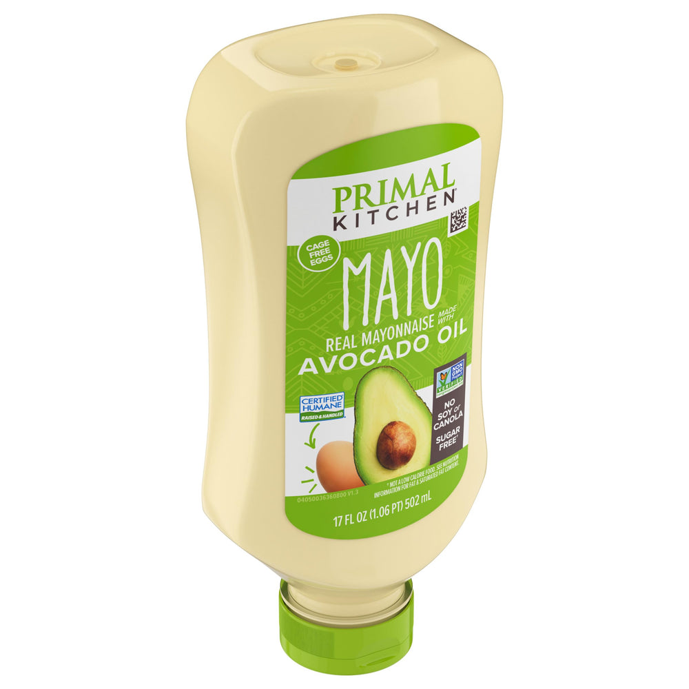 Primal Kitchen mayo spread on burger for creamy flavor.