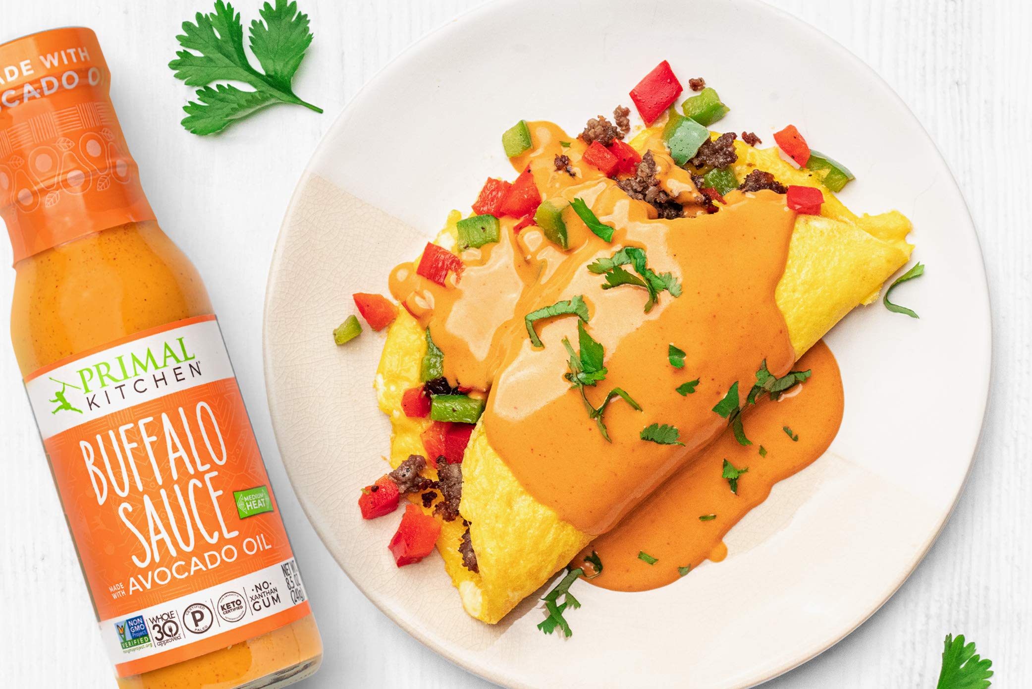 Kitchen-use scene with Primal Kitchen Buffalo Sauce for weeknight meals.