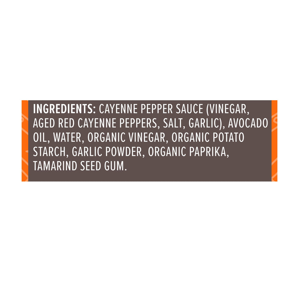 Primal Kitchen No Dairy Buffalo Sauce label close-up emphasizing avocado oil base.