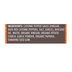 Primal Kitchen No Dairy Buffalo Sauce label close-up emphasizing avocado oil base.