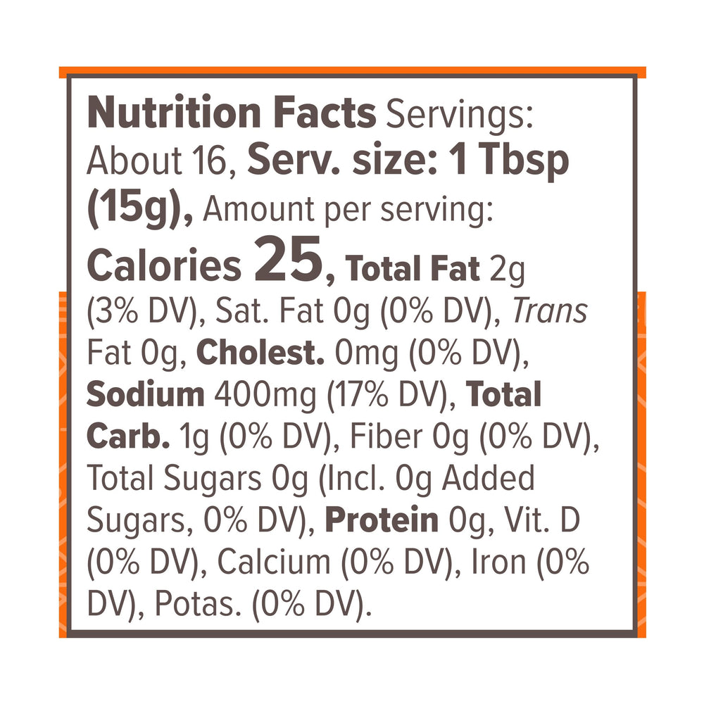 Primal Kitchen No Dairy Buffalo Sauce pour showing smooth texture ideal for wings.