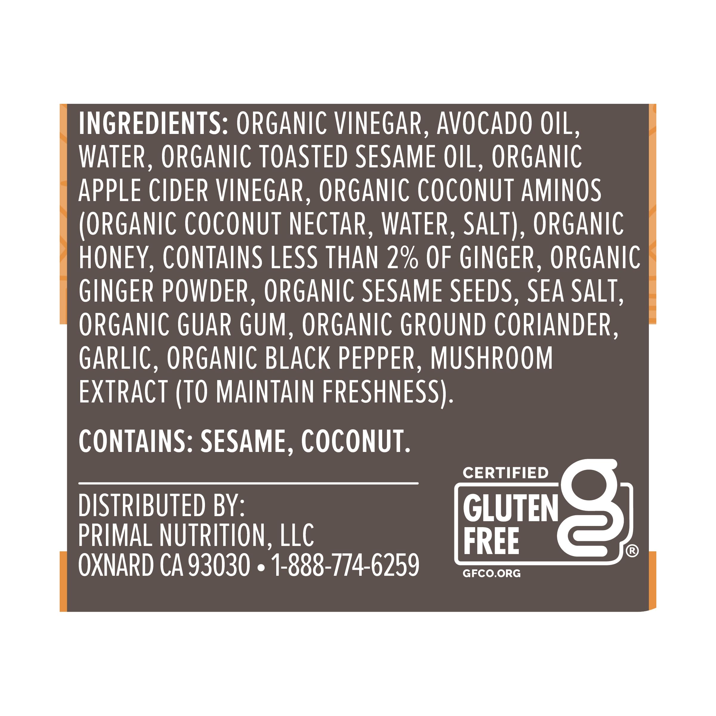 Primal Kitchen Sesame Ginger Vinaigrette on colorful salad bowl.