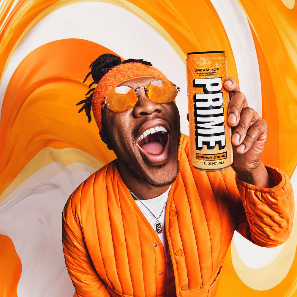 Prime Energy DREAMPOP cold can with ice for a refreshing experience.
