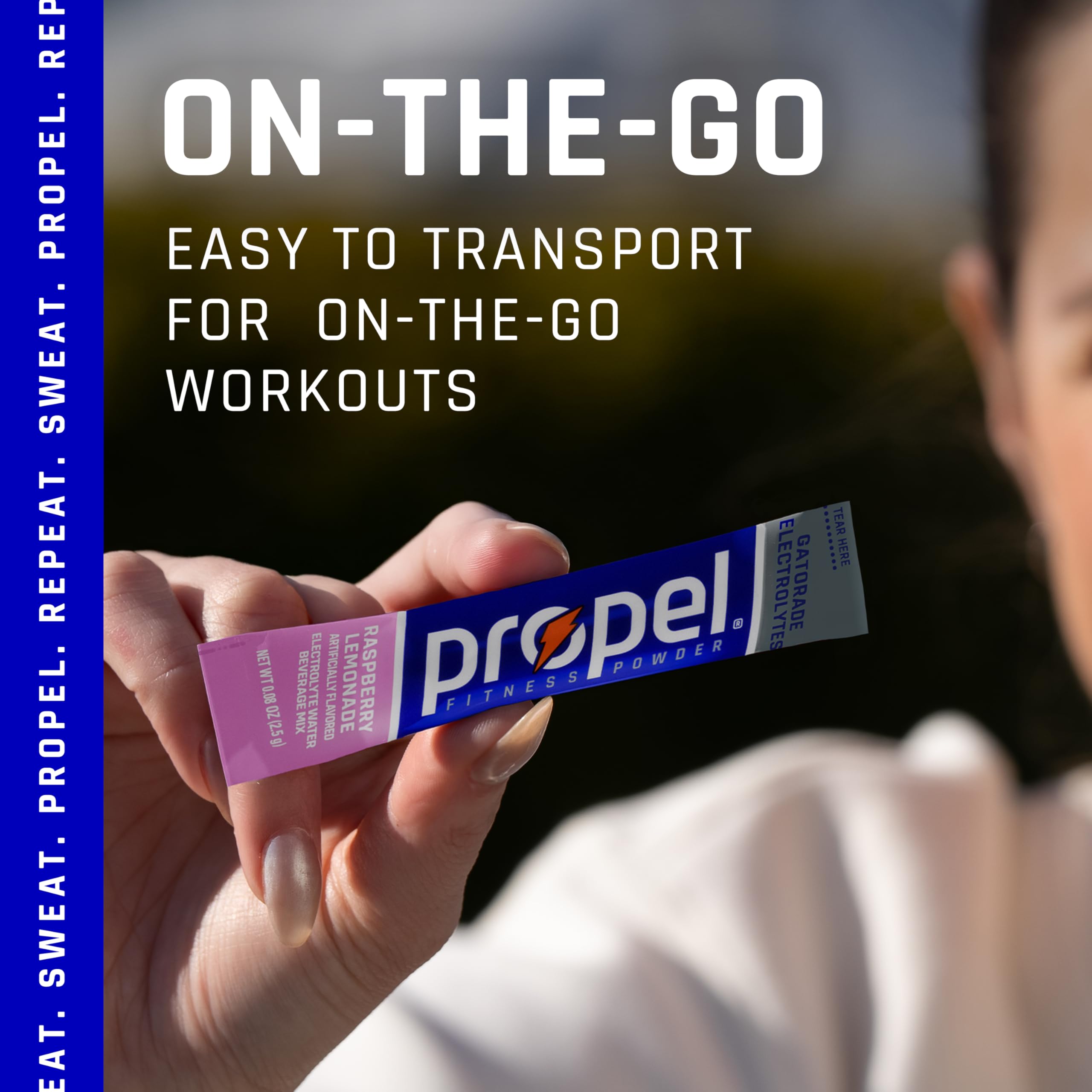 Propel Raspberry Lemonade powder being dispensed for fast hydration.