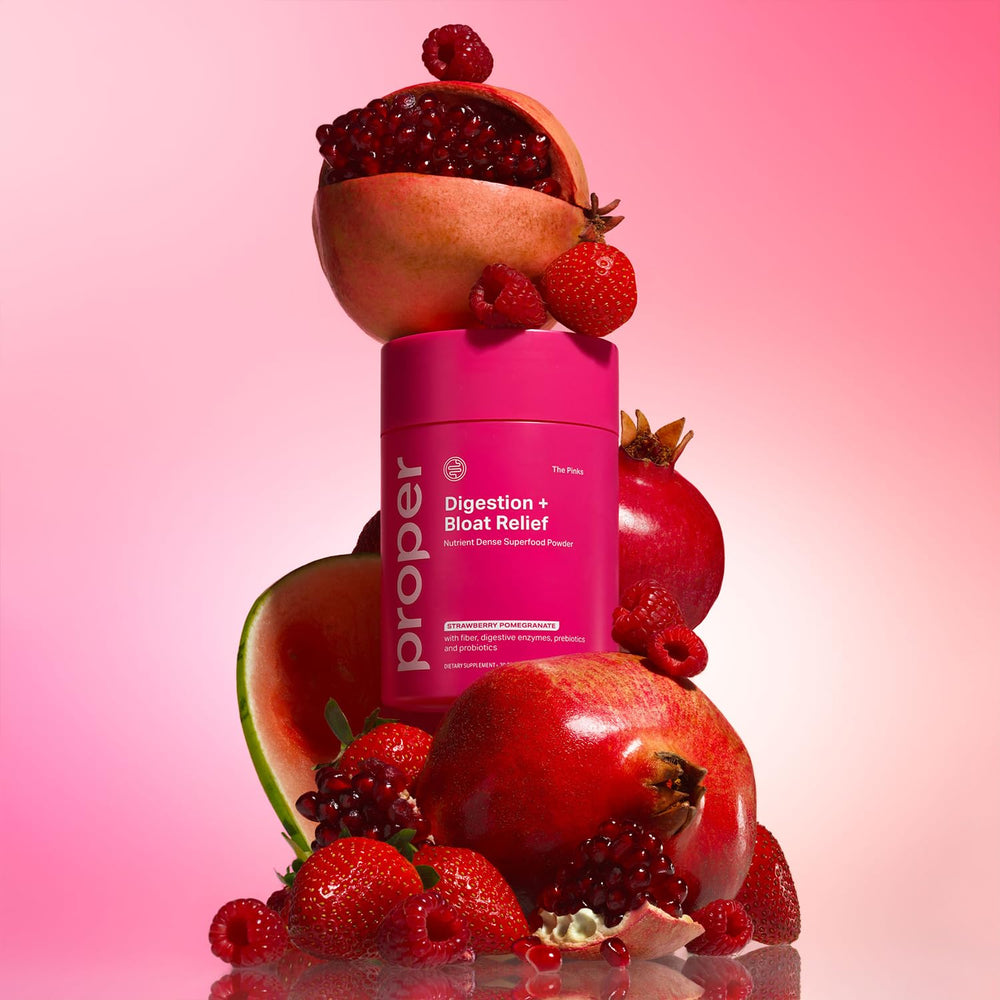 Proper Pinks drink mix in water glass ready to enjoy a tasty routine.