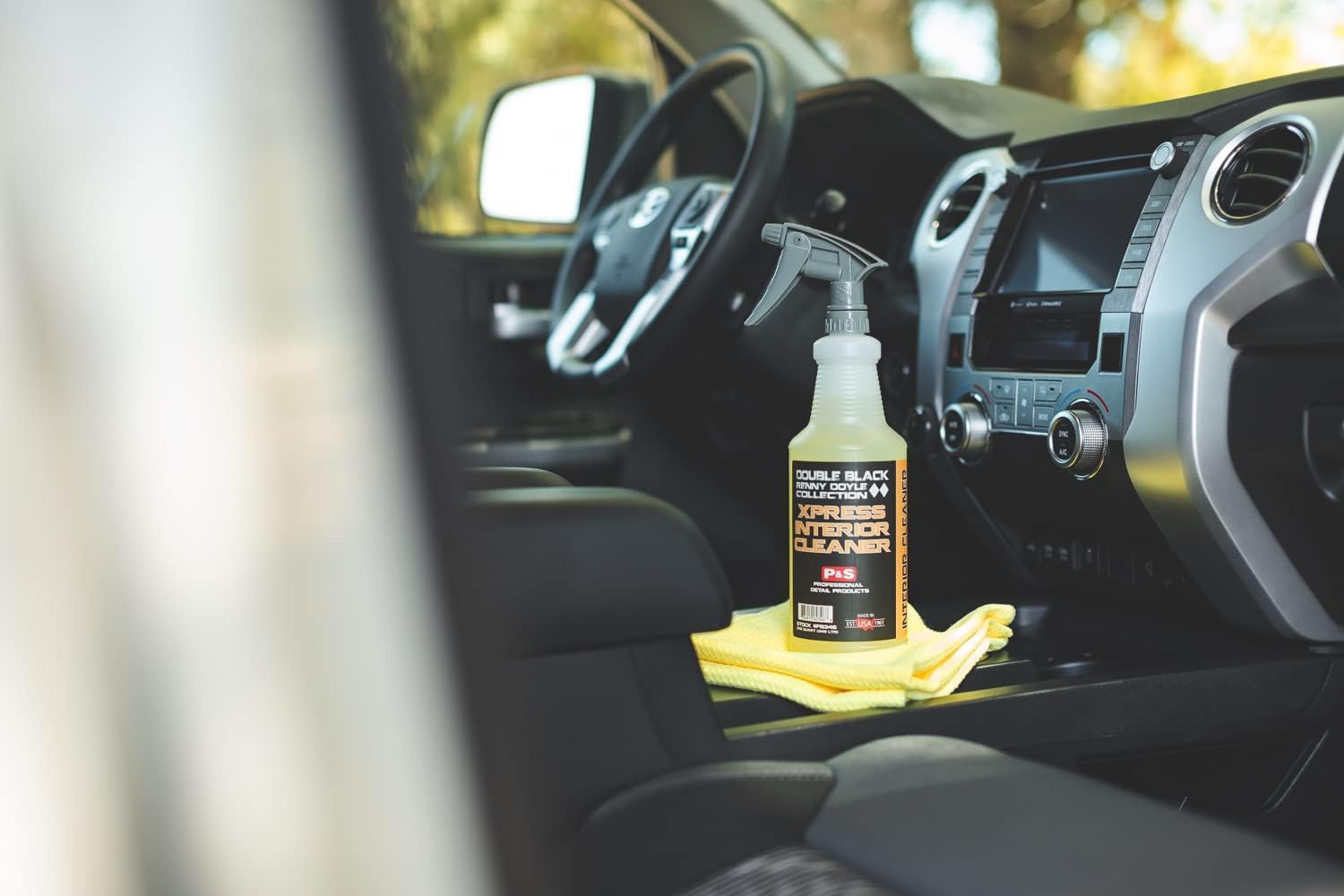 P&S Xpress Interior Cleaner used on leather seating for gentle dirt lifting.