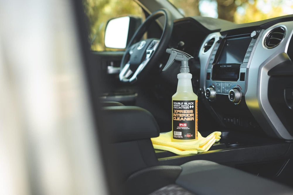P&S Xpress Interior Cleaner used on leather seating for gentle dirt lifting.