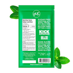Close-up of spearmint PUR Mints showing vibrant mint crystals.