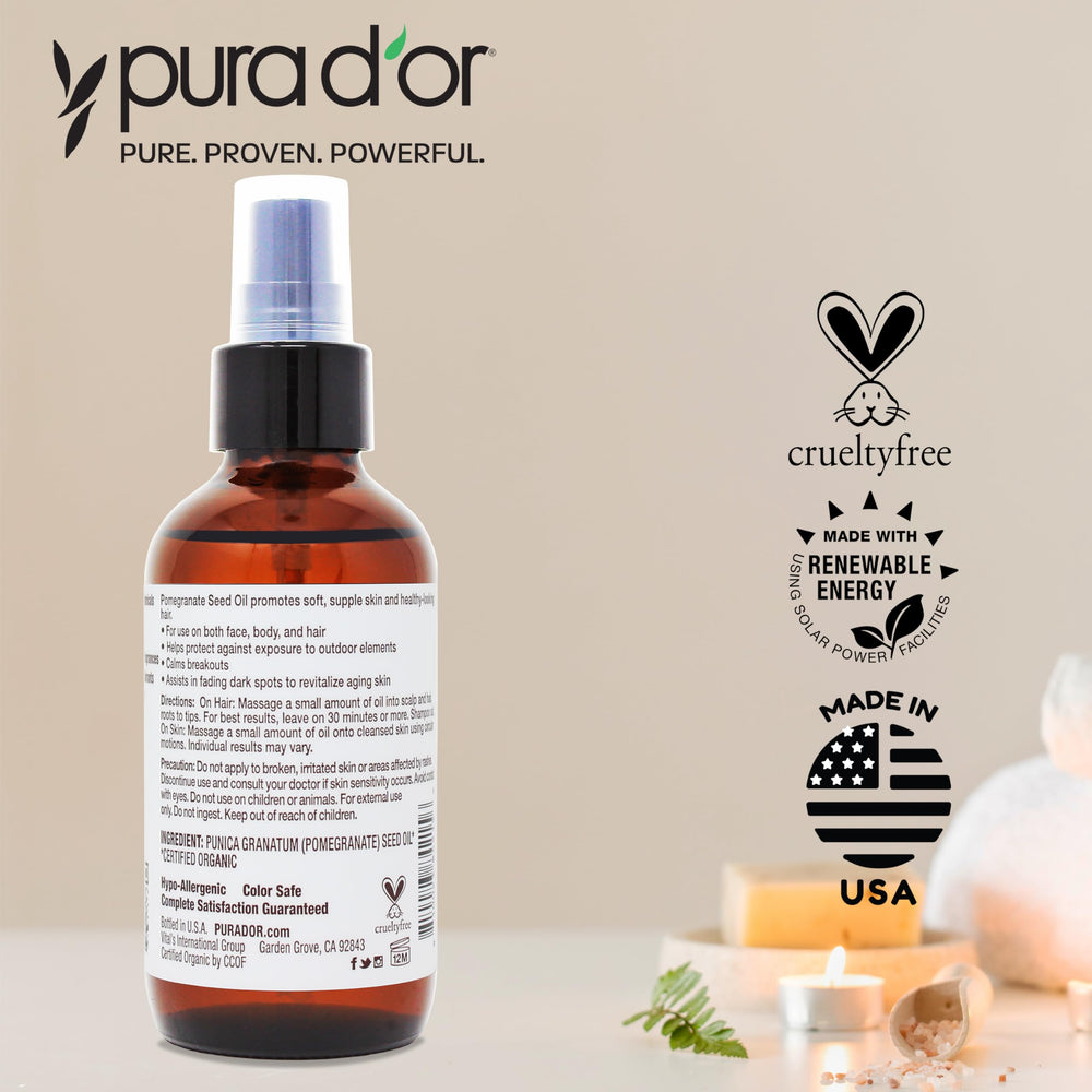 Pura D'or organic pomegranate oil label confirms 100% pure status.
