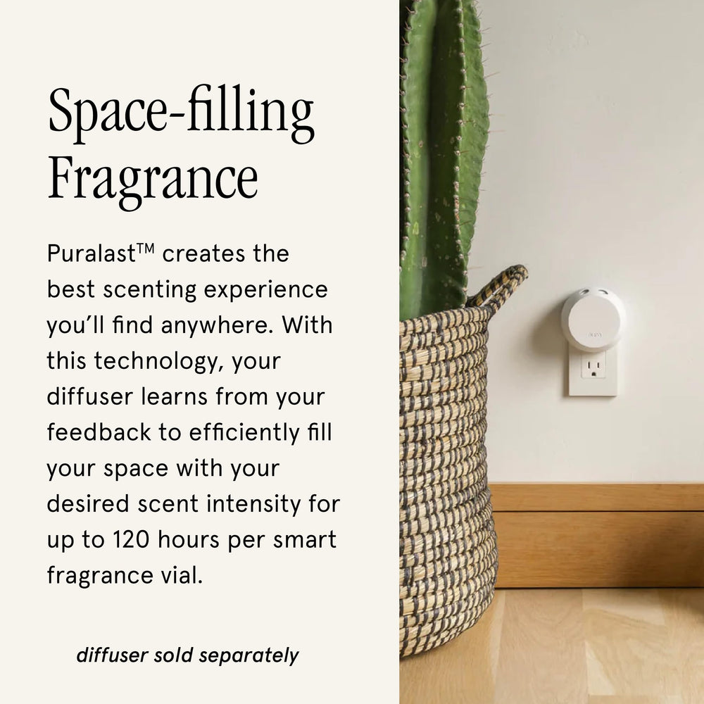 Pura refill vial being inserted for effortless fragrance swaps.