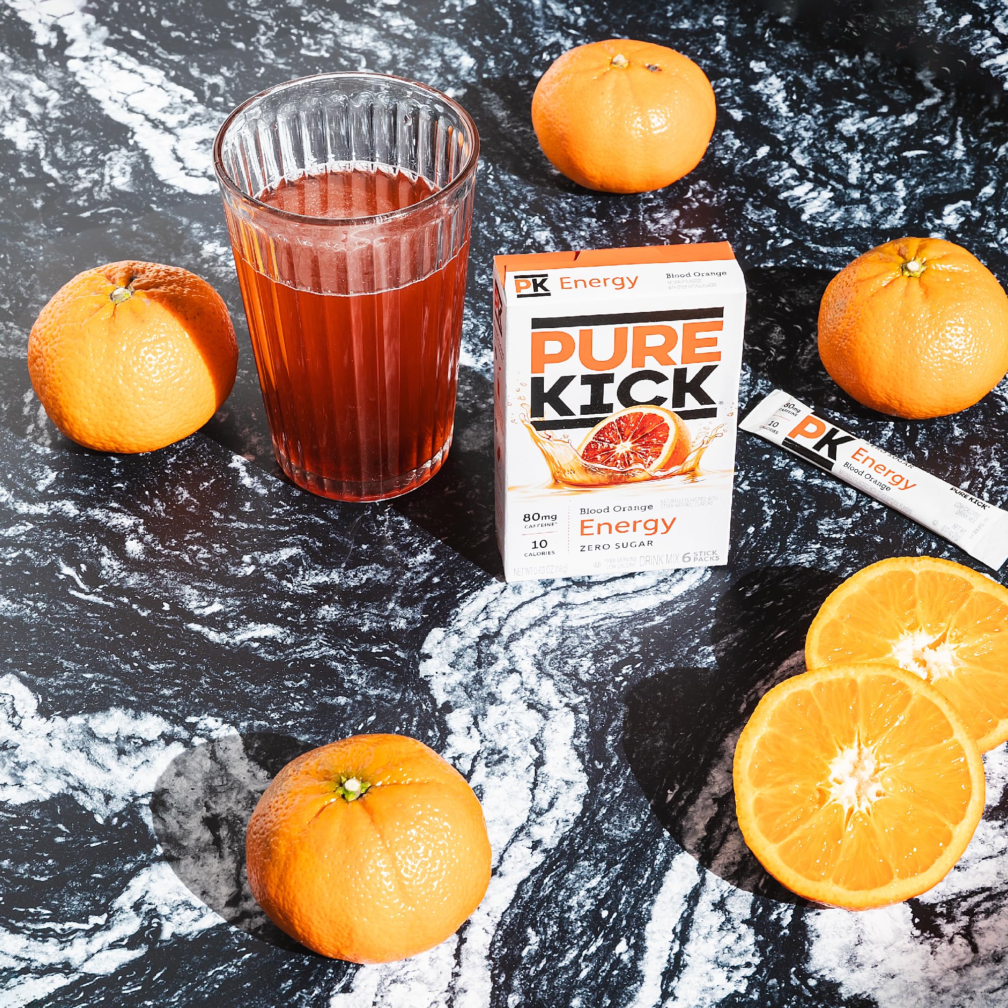 Pure Kick Blood Orange serving in a glass with ice, sugar-free.