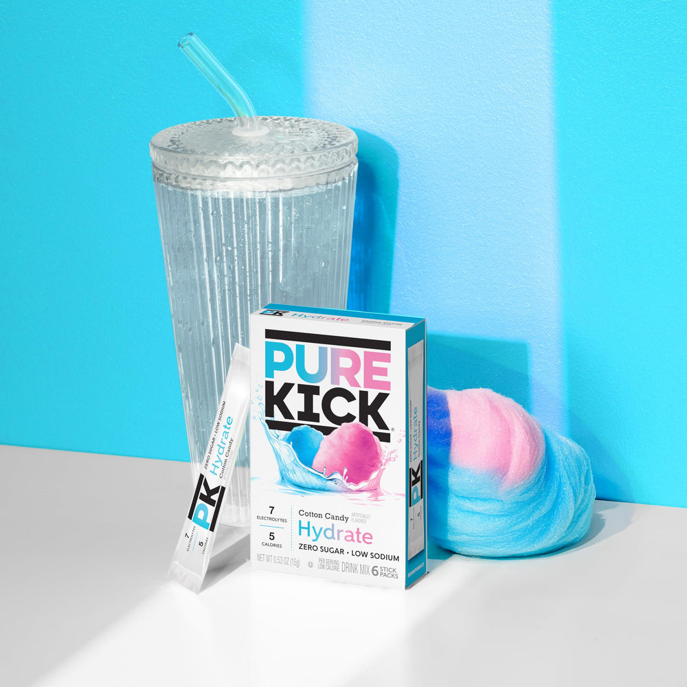 Pure Kick Hydration Cotton Candy being poured into a glass of water