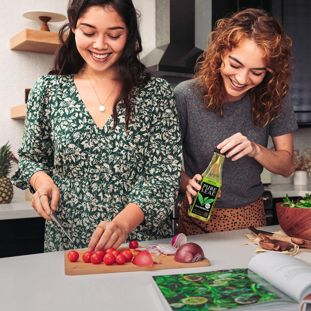 Pure Leaf pour into glass showcasing ready-to-enjoy tea.