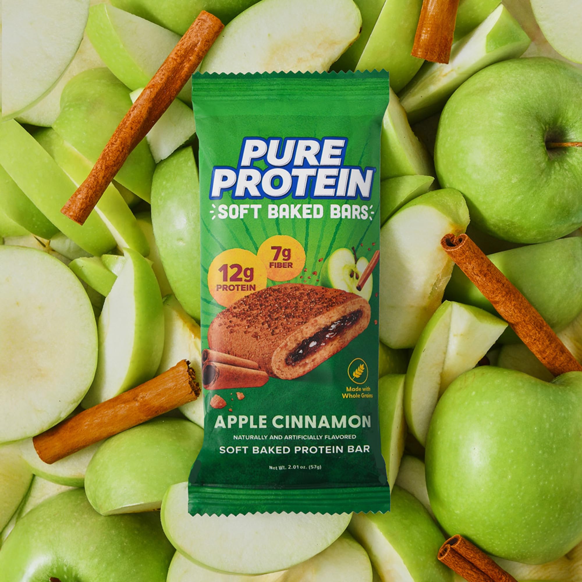 Pure Protein Apple Cinnamon bar in foil wrap on desk