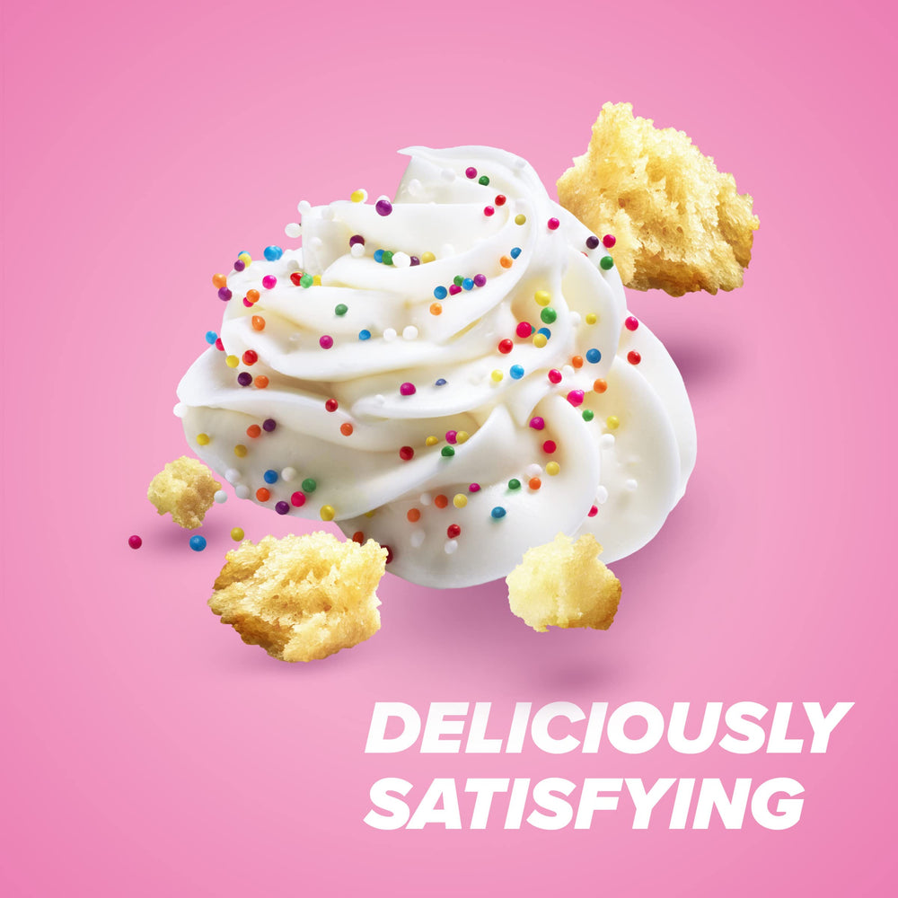 Pure Protein Birthday Cake bar bite shot, creamy frosting notes in every bite.