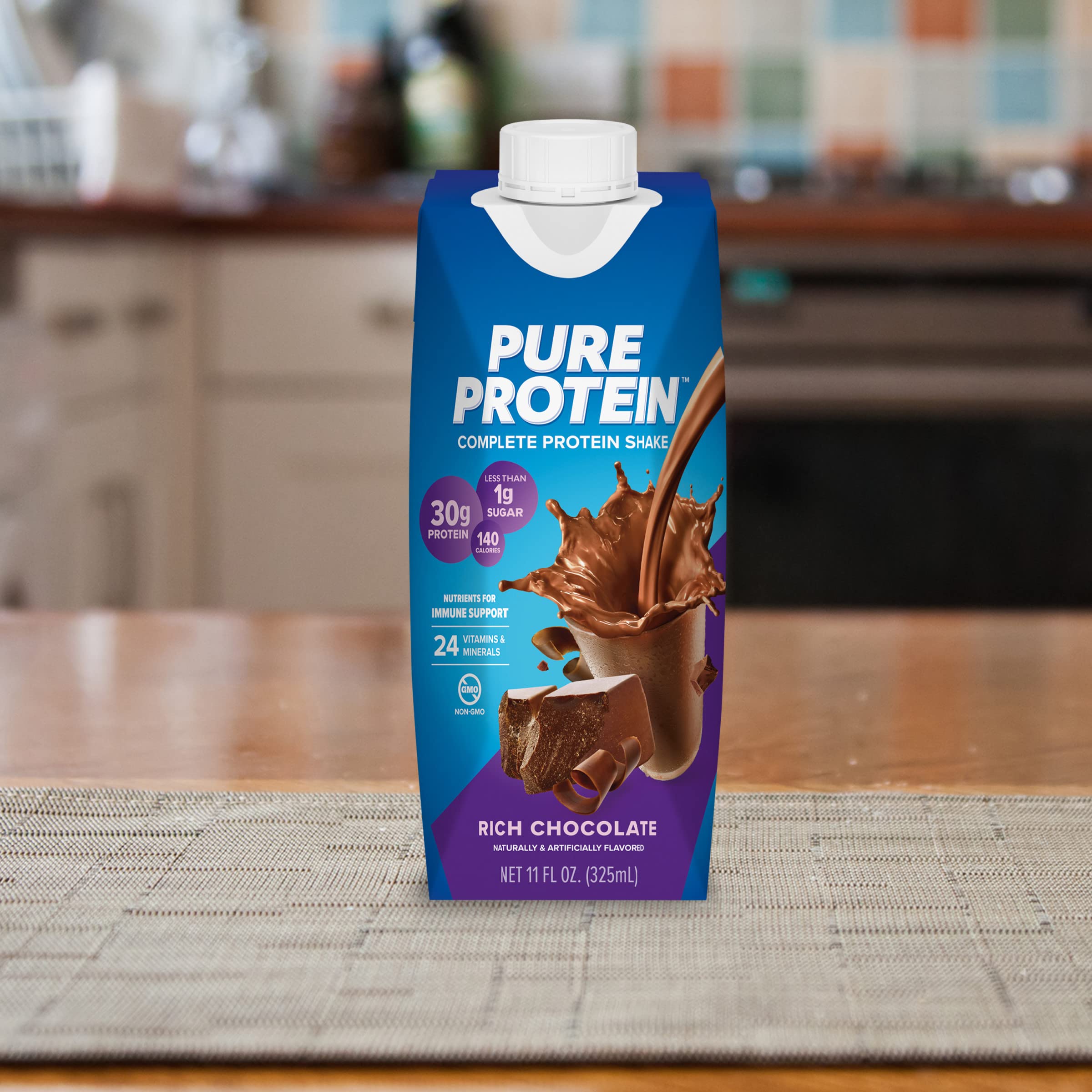 Spoonful of chocolate shake texture demonstrating smooth flavor of Pure Protein