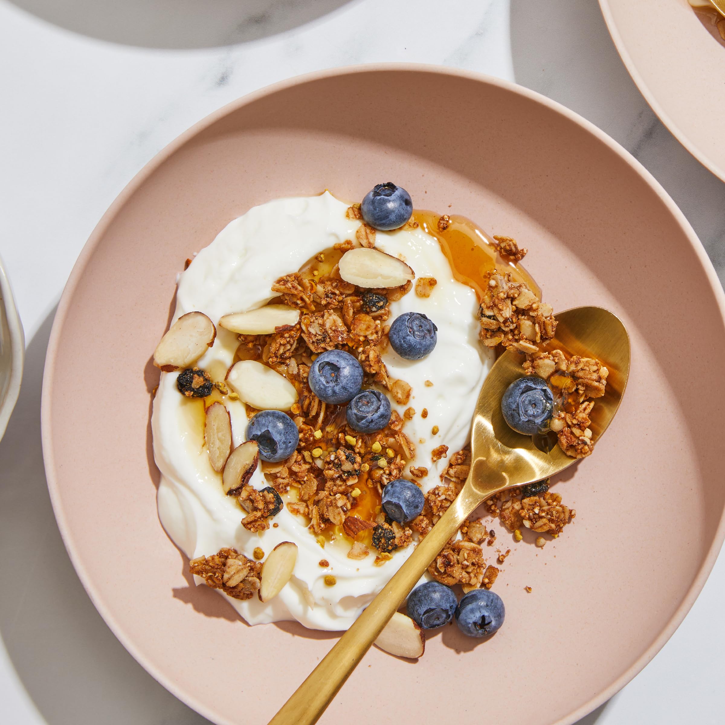 Three-pack pantry-friendly packaging for Purely Elizabeth Blueberry Ancient Grain Granola