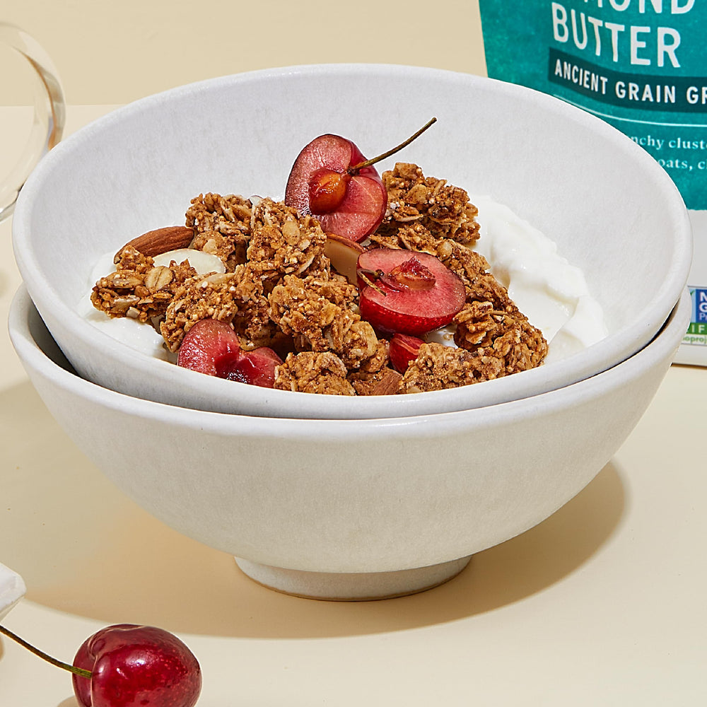 Purely Elizabeth granola on fruit bowl demonstrates versatile snack option