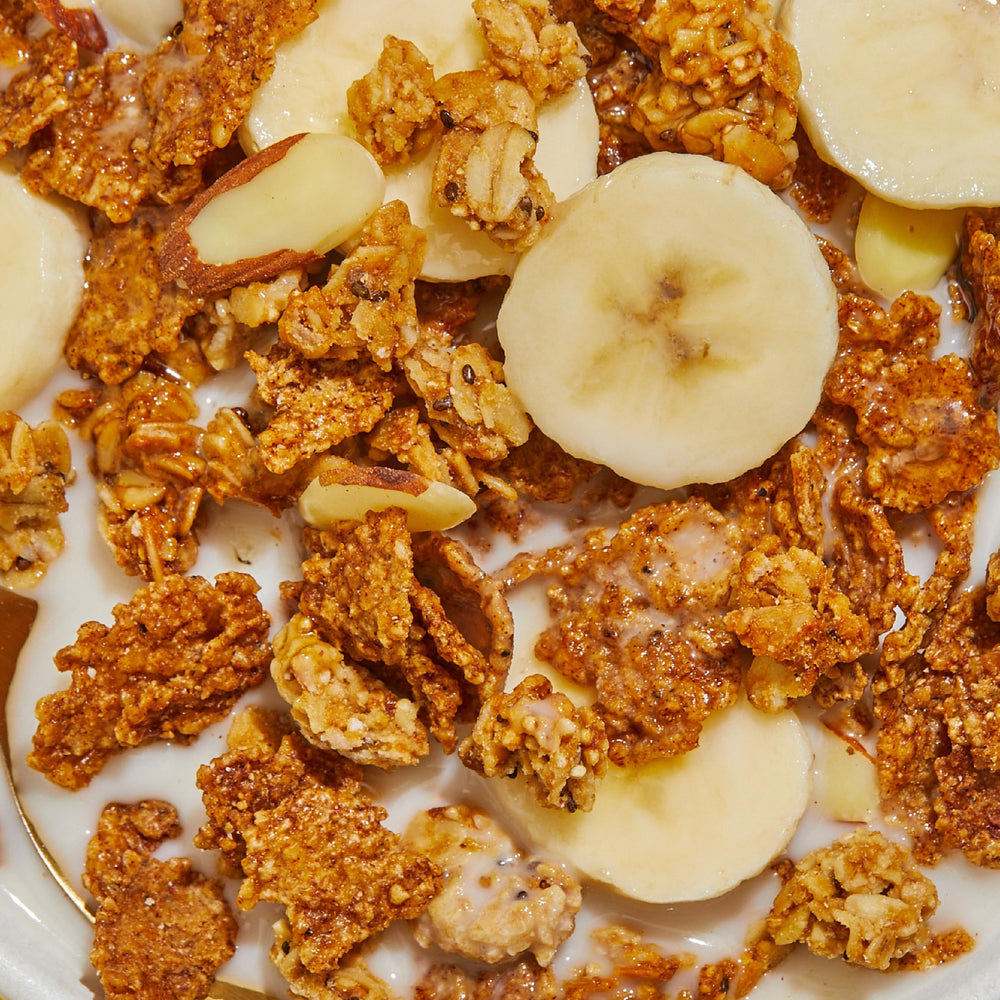 Purely Elizabeth pouring shot of coconut sugar-sweetened cereal suggests natural sweetness.