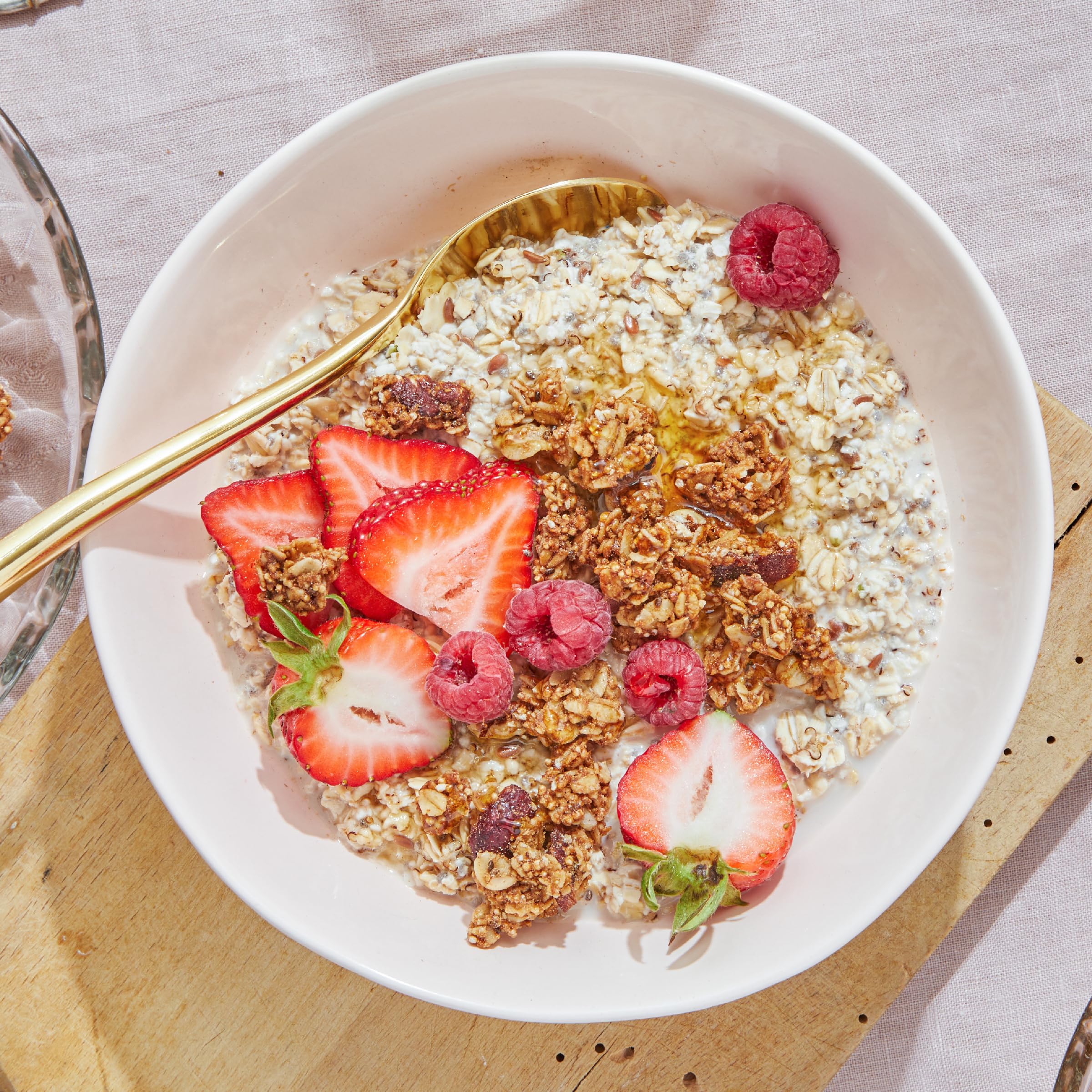 Purely Elizabeth Cranberry Pecan Granola ingredients show seeds and cranberries, a wholesome mix.