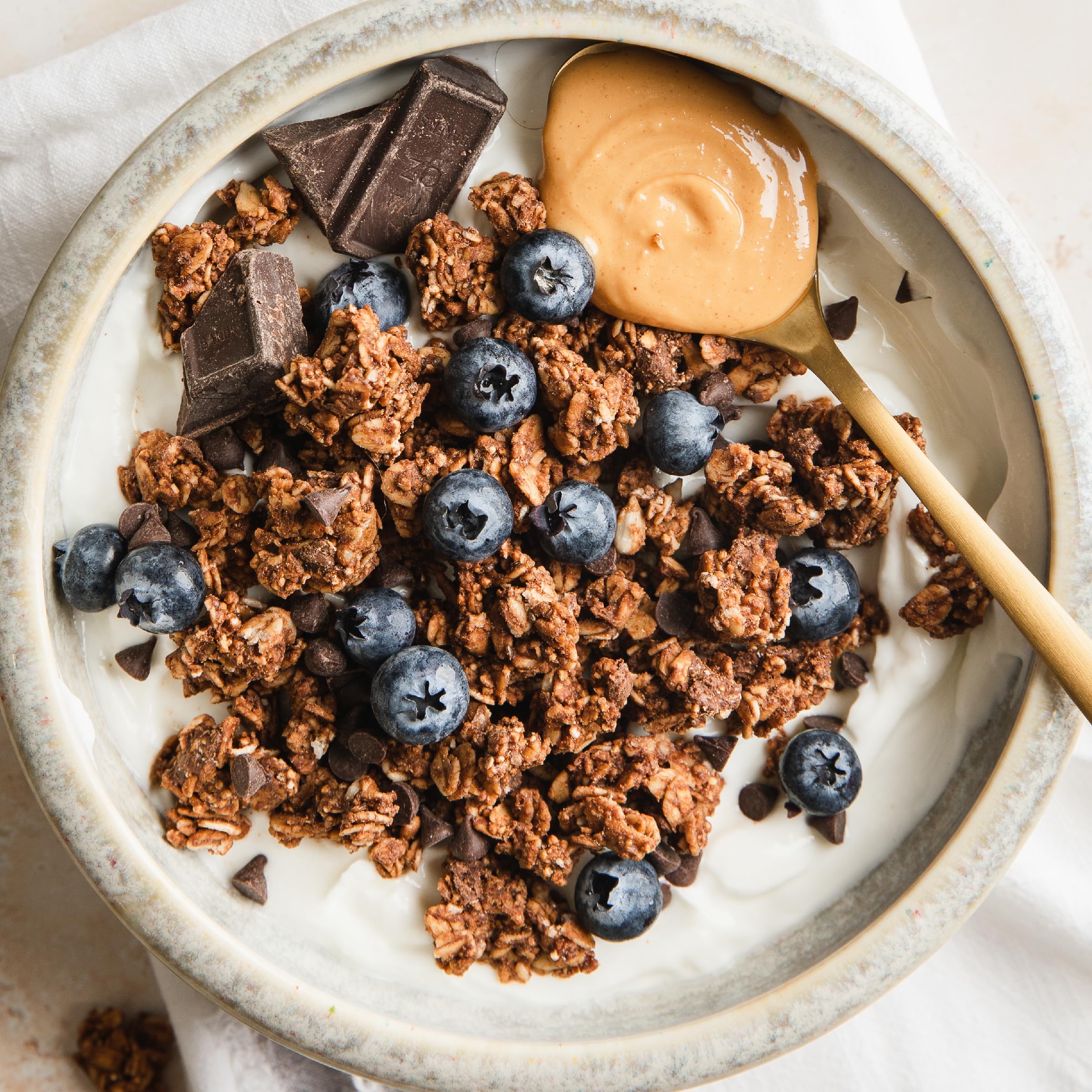 Purely Elizabeth probiotic granola packaging shown on kitchen shelf.