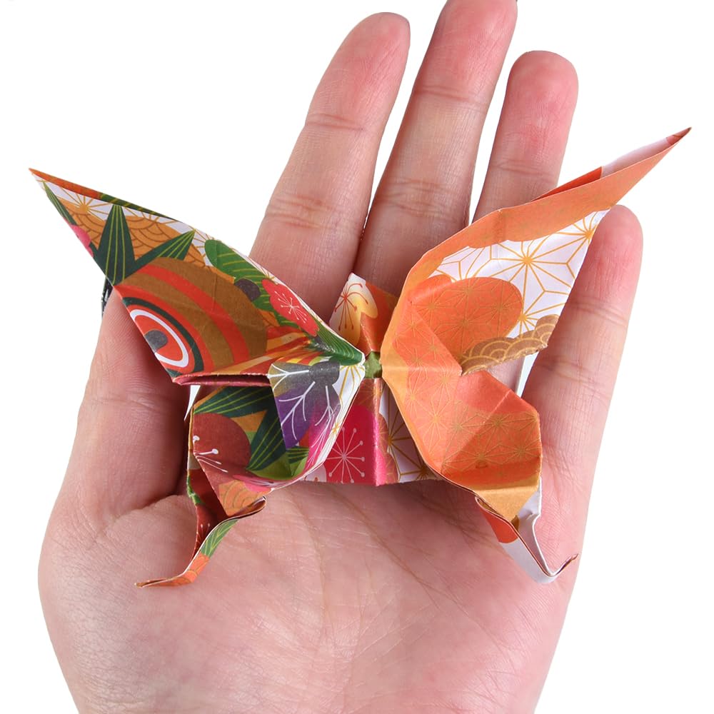 Qianshan origami paper set highlighting folding ideas like flowers and birds.