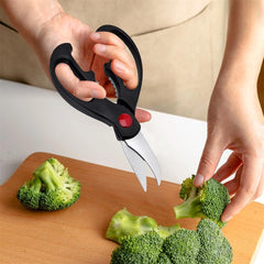 QtoiKce poultry-ready scissors demonstrate strong jaws for chicken preparation.