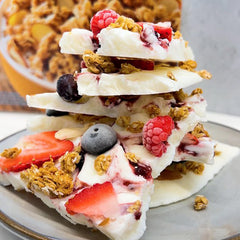 Granola in a bowl showing texture and almonds, ideal as a snack