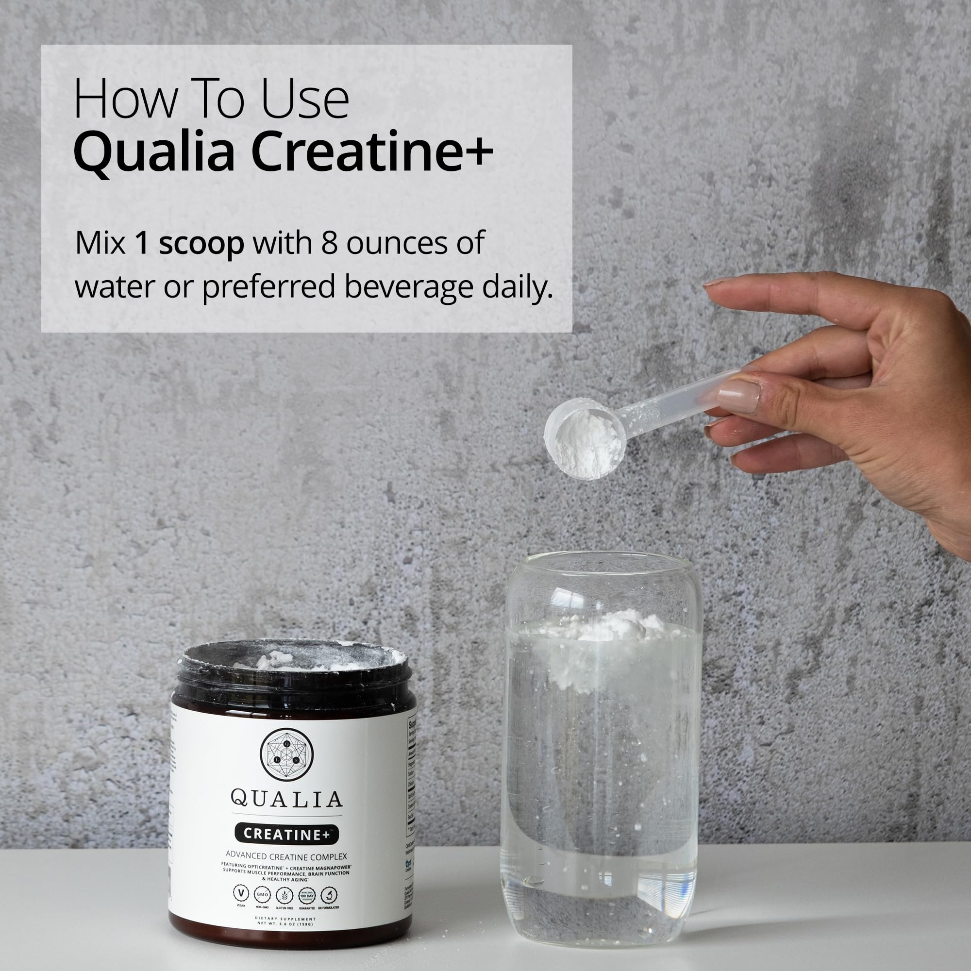 Qualia Creatine+ daily-use scoop beside bottle for routine.
