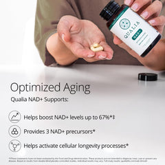 Qualia NAD supplement bottle on desk suggests a daily wellness routine.