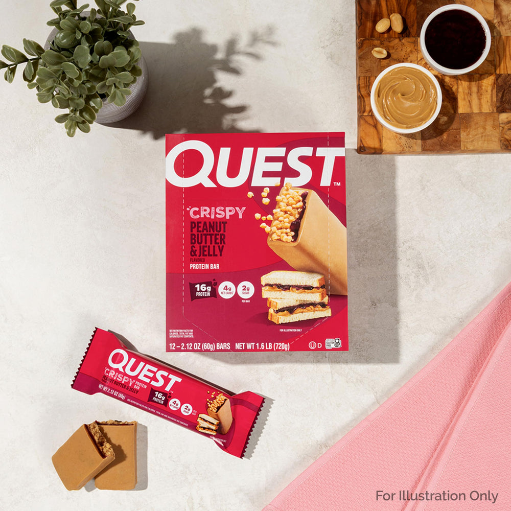 Quest Crispy PB&J bar on desk or gym bag for fueling