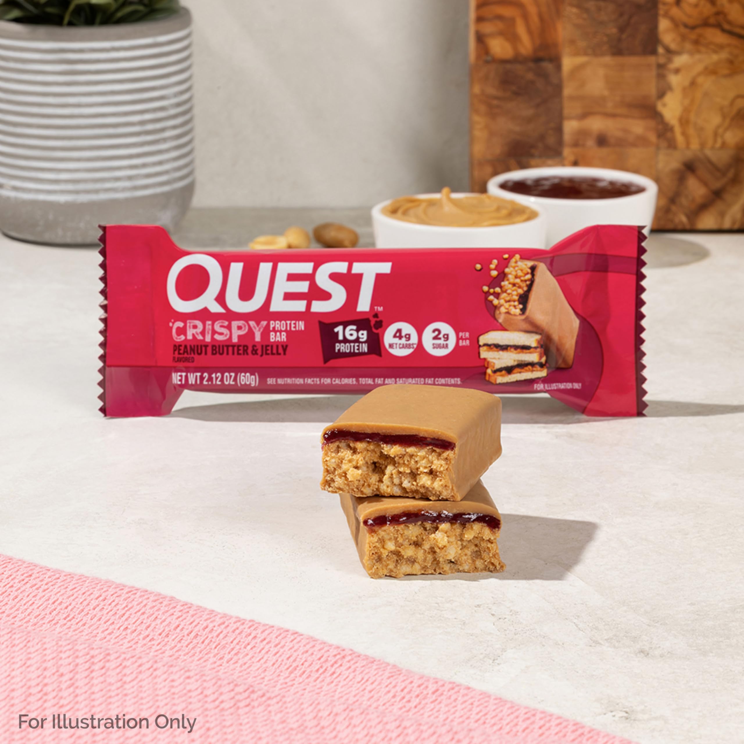 Quest Crispy PB&J bar held on-the-go for quick protein snack
