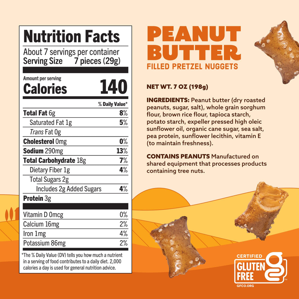 Quinn gluten-free PB-filled pretzels mid-bite showing creamy center.